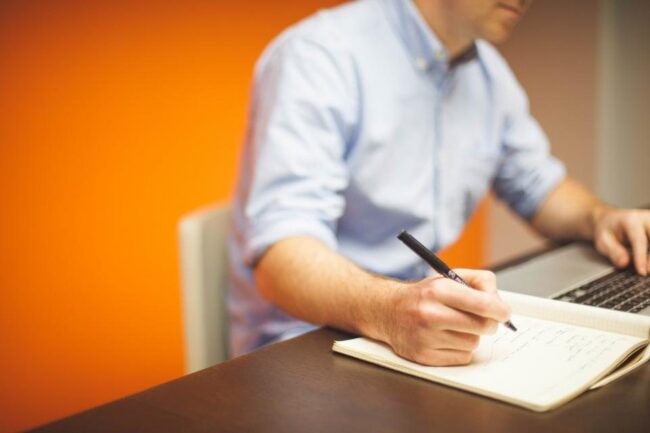 Writing in notebook office